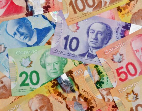 Pile of Canadian dollar bills in various denominations