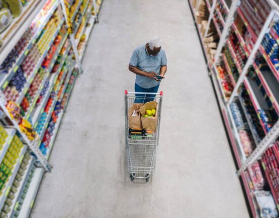 man shops at grocery store