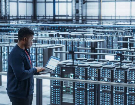 Data Center Engineer Using Laptop Computer crypto mining