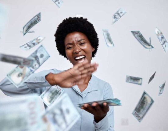 happy woman throws cash