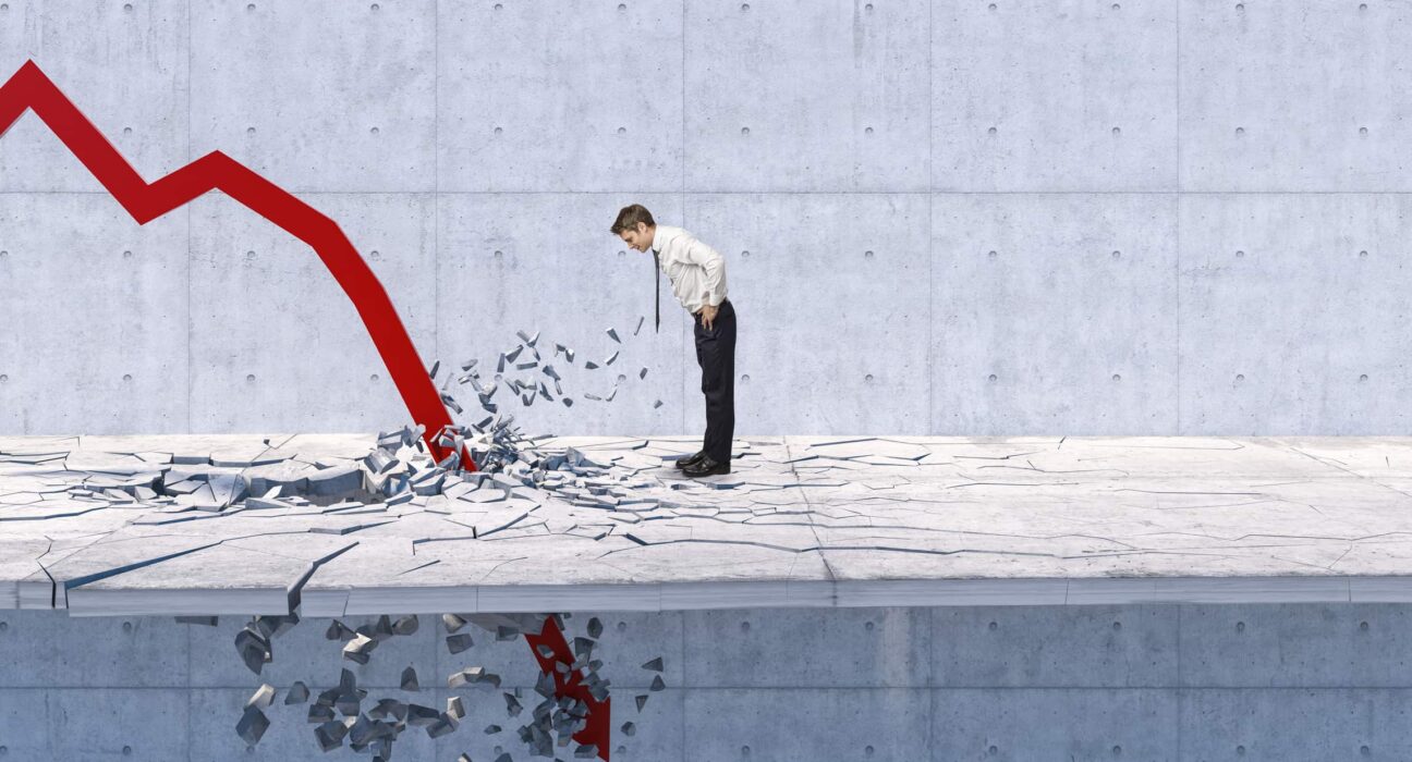 a person watches a downward arrow crash through the floor