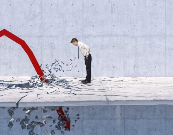 a person watches a downward arrow crash through the floor